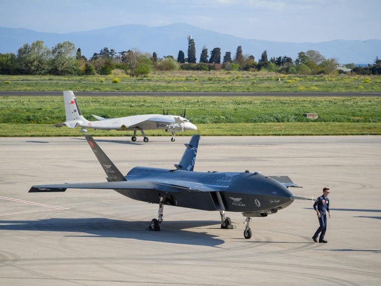 Advanced military drones on a tarmac in Istanbul, Turkey, showcasing modern aerial technology.